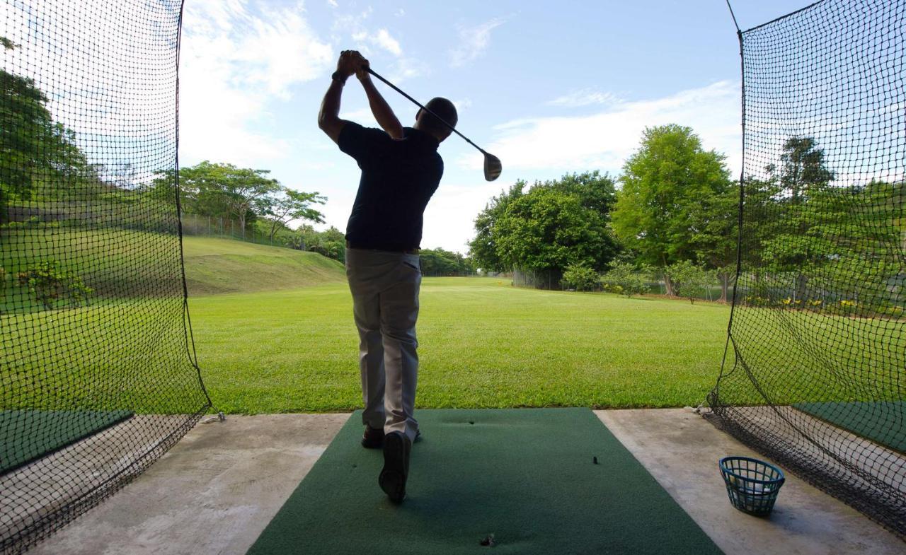 Outrigger Fiji Beach Resort Korotogo Bagian luar foto A golfer practicing at a driving range
