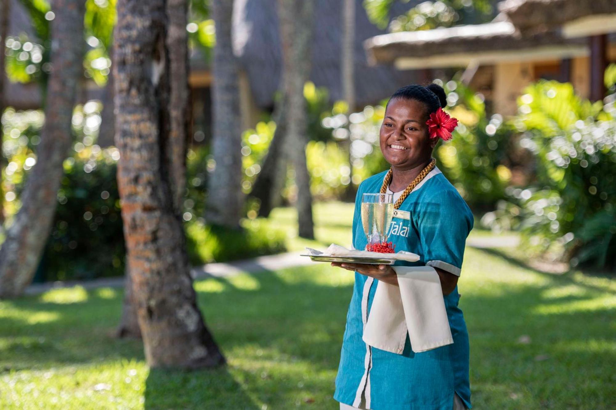 Outrigger Fiji Beach Resort Korotogo Bagian luar foto A hotel staff in Mauritius